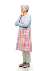 Image showing portrait of thinking senior woman in apron