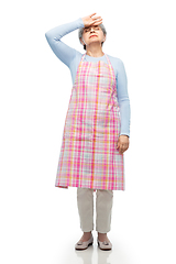 Image showing tired senior woman in apron