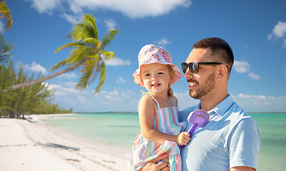 Image showing happy father with little daughter on beach