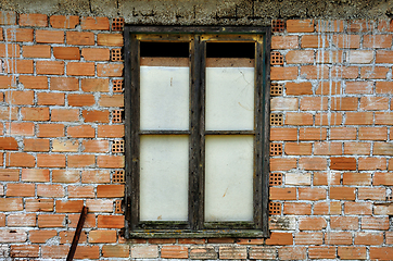 Image showing stained brick wall and boarded up window