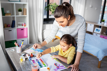 Image showing mother with little daughter drawing at home