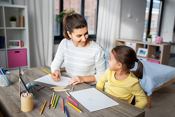 Image showing mother with little daughter drawing at home