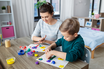 Image showing mother and son playing with modeling clay at home