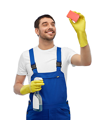 Image showing male cleaner cleaning with sponge and detergent