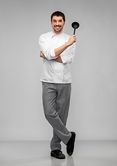 Image showing happy smiling male chef in jacket with ladle