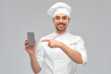 Image showing happy smiling male chef showing smartphone