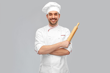 Image showing happy smiling male chef or baker with rolling pin