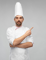 Image showing male chef in toque pointing finger