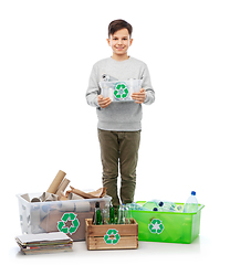 Image showing smiling boy sorting paper, metal and plastic waste