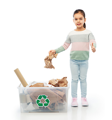 Image showing girl sorting paper waste and showing thumbs up