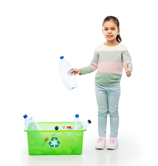 Image showing girl sorting plastic waste and showing thumbs up