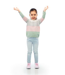 Image showing happy girl with raised arms over white background