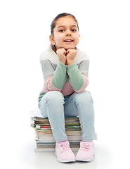 Image showing smiling girl with magazines sorting paper waste