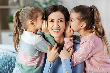 Image showing happy mother and daughters gossiping at home