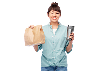 Image showing woman with thermo cup or tumbler for hot drinks