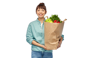 Image showing happy asian woman with food in paper shopping bag