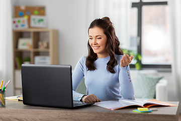 Image showing teacher with laptop having online class at home