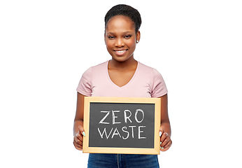 Image showing happy woman holds chalkboard with zero waste words