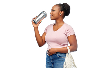 Image showing woman with tumbler and food in string bag