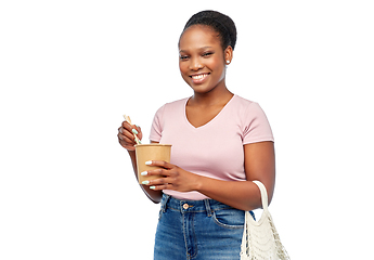 Image showing happy woman with reusable bag for food and wok