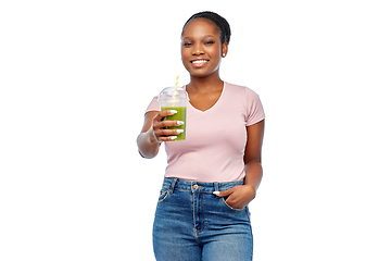 Image showing happy african american woman drinking green juice