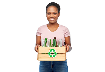 Image showing happy african american woman sorting glass waste