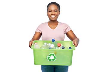 Image showing smiling young asian woman sorting plastic waste