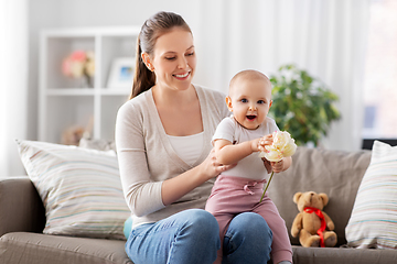 Image showing happy smiling mother with little baby at home