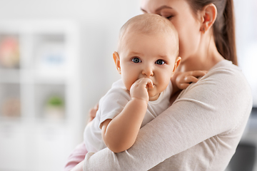 Image showing happy mother with little baby daughter at home