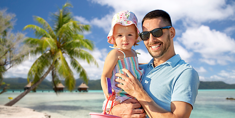 Image showing happy father with little daughter on beach