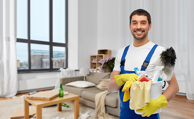 Image showing male cleaner with cleaning supplies at home