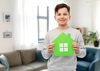 Image showing smiling boy holding green house icon