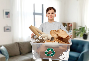 Image showing smiling boy sorting paper waste