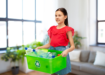 Image showing smiling girl sorting plastic waste at home