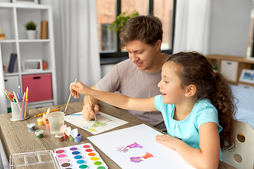 Image showing happy father with little daughter drawing at home