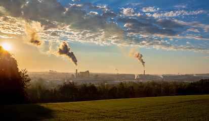 Image showing industrial cityscape with with smoking factory