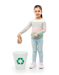 Image showing girl throwing paper waste into rubbish bin