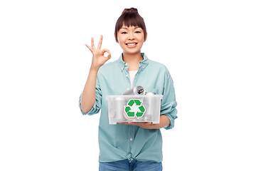 Image showing smiling young asian woman sorting metallic waste