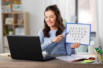 Image showing teacher with alphabet having online class at home