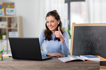 Image showing teacher with laptop having online class at home