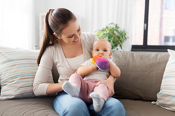 Image showing happy smiling mother with little baby at home