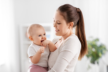 Image showing happy mother with little baby daughter at home