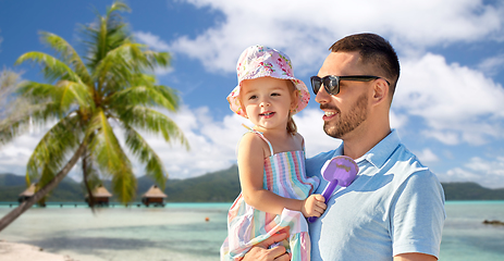 Image showing happy father with little daughter on beach