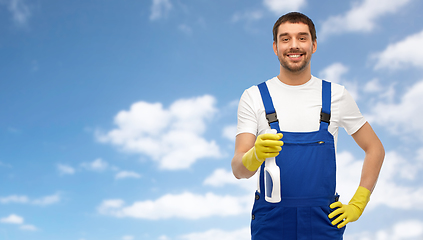 Image showing male cleaner cleaning with detergent