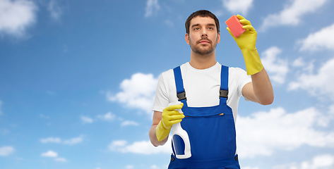 Image showing male cleaner cleaning with sponge and detergent