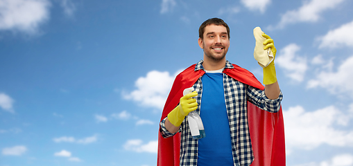 Image showing smiling man in superhero cape with rag and cleaner