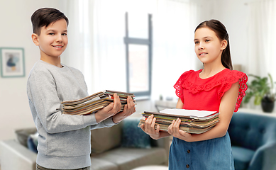 Image showing boy and girl with magazines sorting paper waste