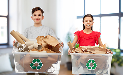 Image showing smiling girl and boy sorting paper waste