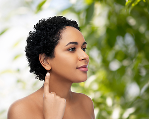 Image showing african american woman showing her ear