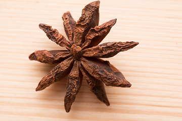 Image showing Organic star anise on a wooden table